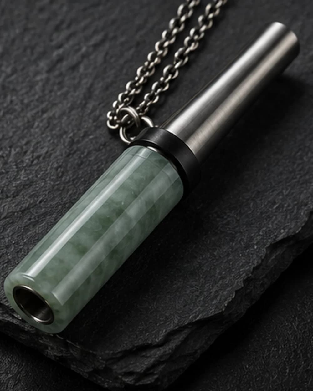 Stone mouthpiece resting on a basalt slab in the workshop